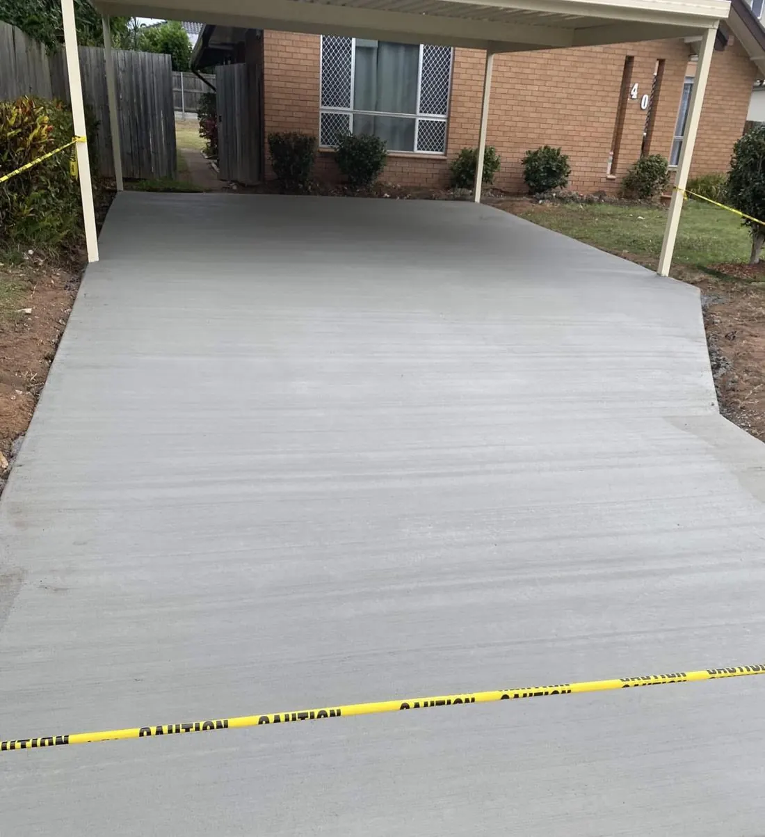 Carport driveway — Broom finish